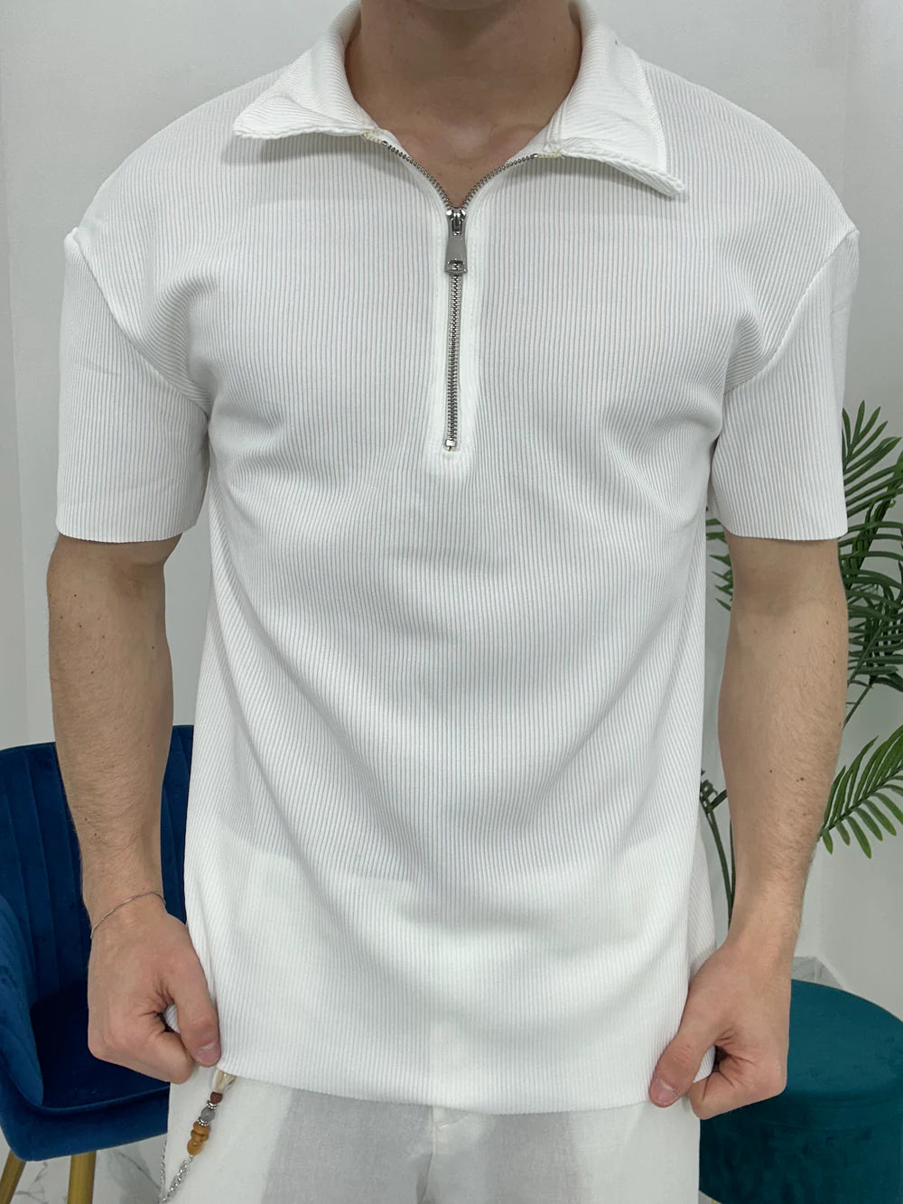 POLO CON ZIP A COSTINE TAGLIO VIVO