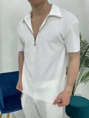 POLO CON ZIP A COSTINE TAGLIO VIVO