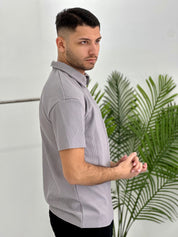 POLO CON ZIP A COSTINE TAGLIO VIVO