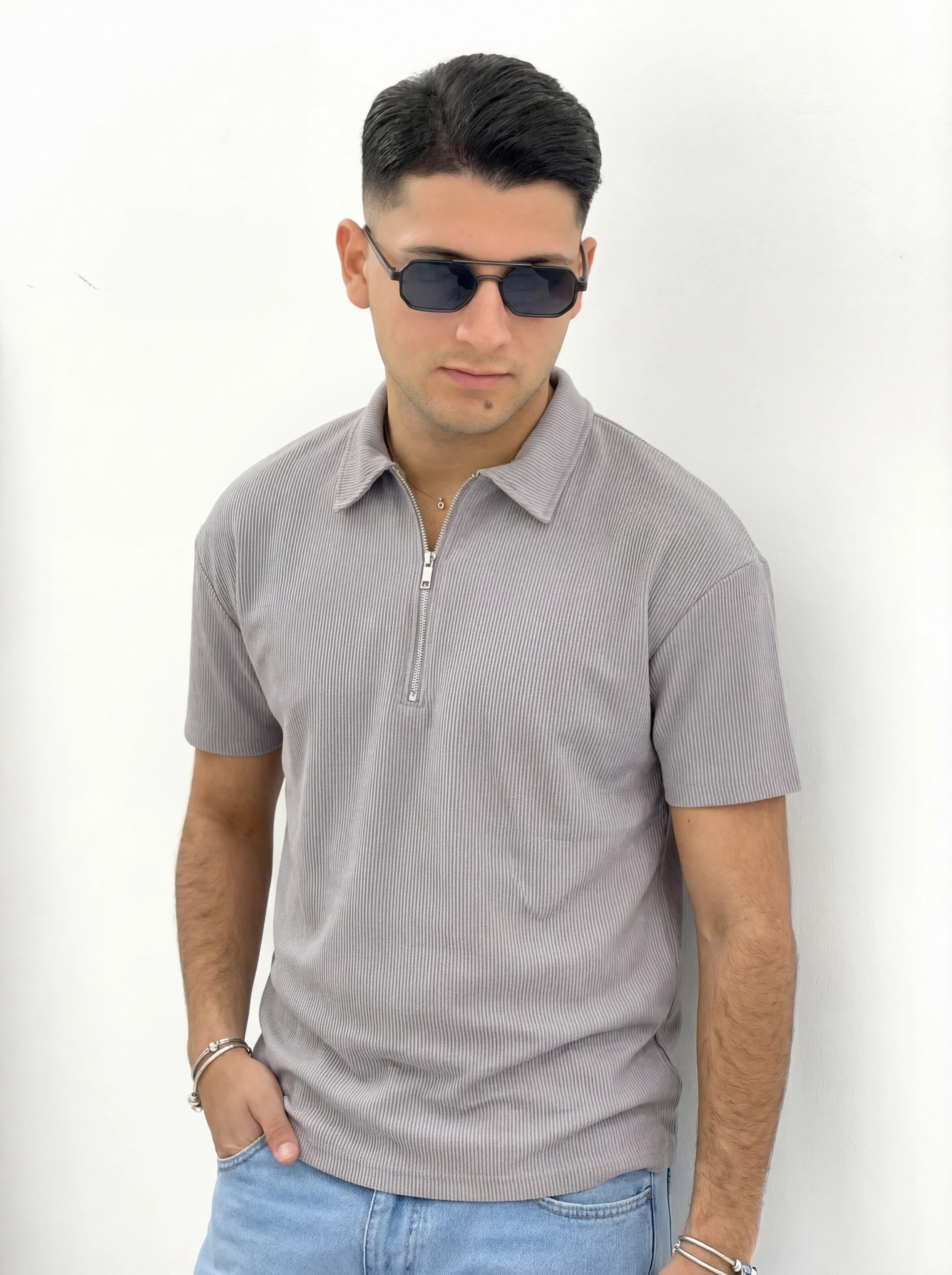 POLO CON ZIP A COSTINE TAGLIO VIVO