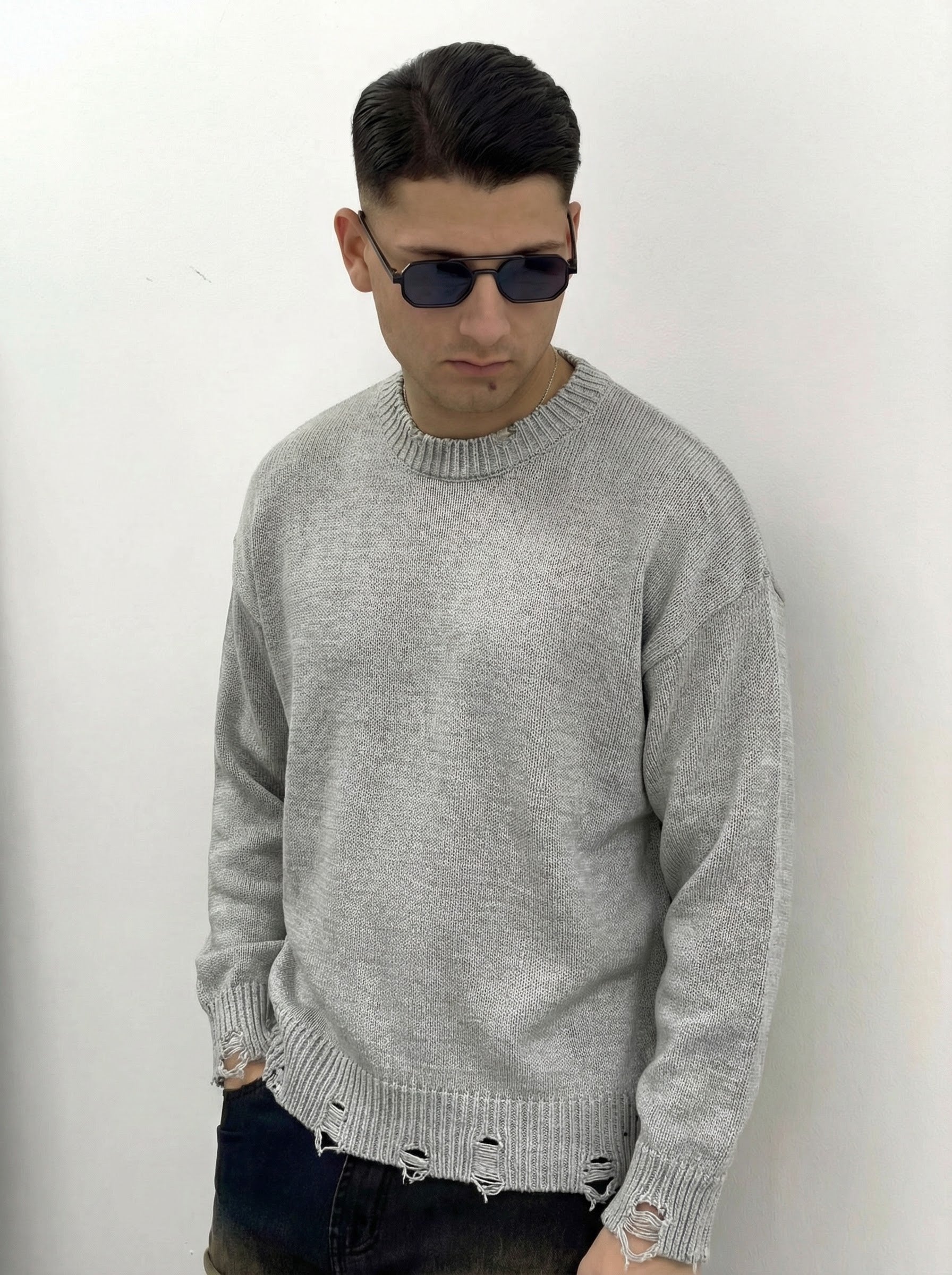 MAGLIONE CON ROTTURE