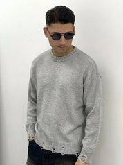 MAGLIONE CON ROTTURE