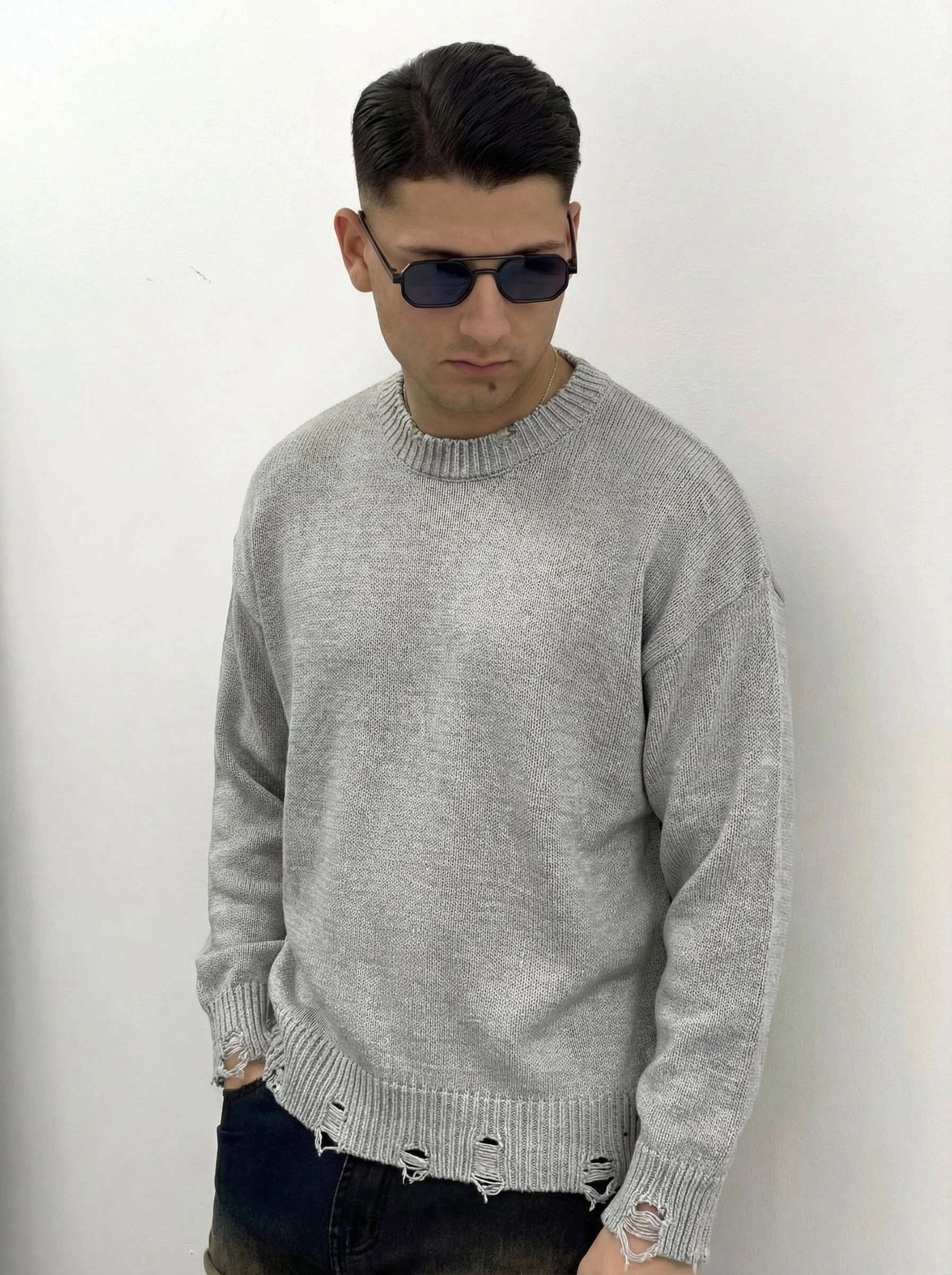 MAGLIONE CON ROTTURE